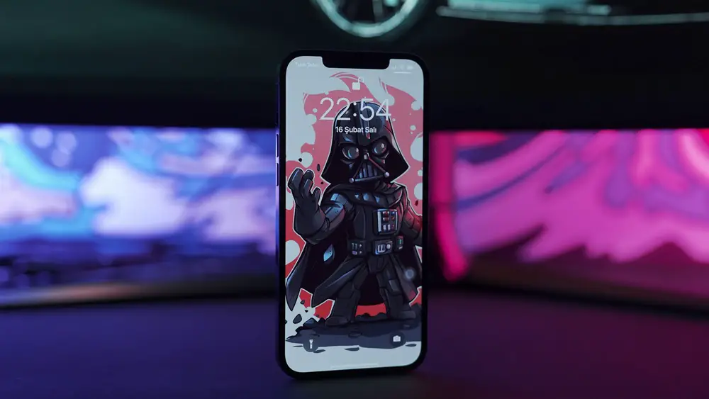 Smartphone buying tips: This photo depicts an iPhone 12 Pro sitting on the table with Darth Vader wallpaper.