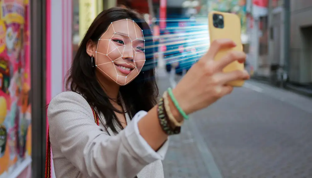 Smartphone buying tips: This photo depicts a woman trying to unlock her smartphone using face recognition technology.